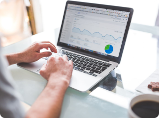 a man watching a diagram on his white laptop