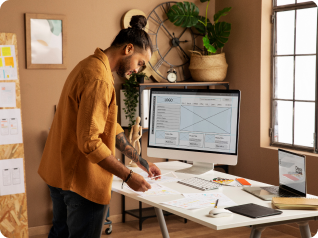 a man with tattoo designing a website